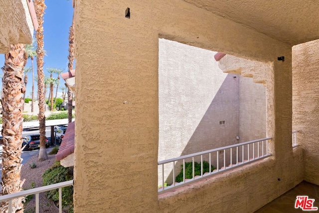 view of side of property featuring a balcony