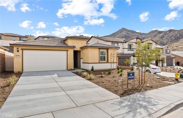 view of front of house with a mountain view and a garage