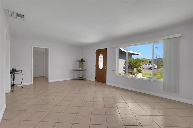 entryway featuring visible vents, baseboards, and light tile patterned floors