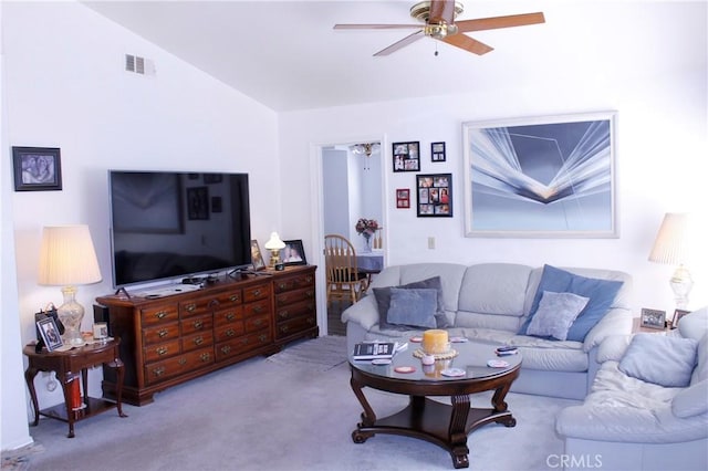 carpeted living room featuring vaulted ceiling and ceiling fan