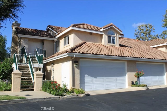 mediterranean / spanish-style home featuring a garage