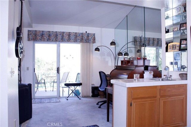 carpeted office space featuring sink