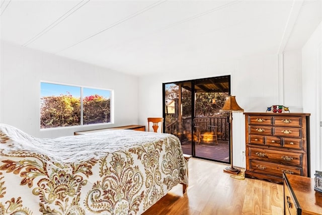 bedroom with hardwood / wood-style flooring