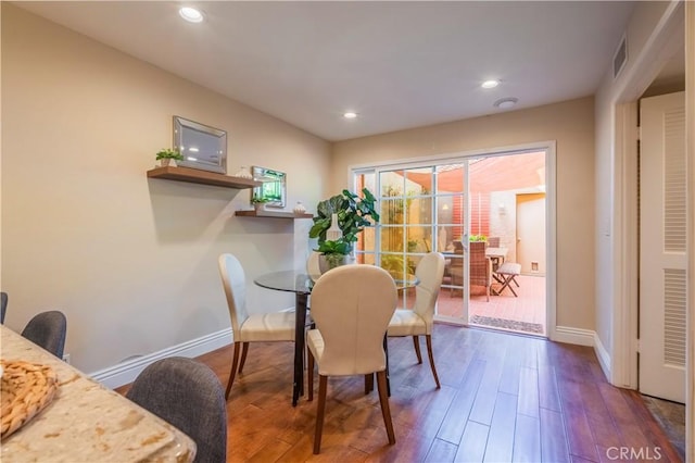 dining space featuring hardwood / wood-style floors