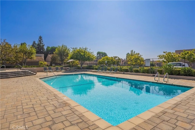 view of swimming pool with a patio