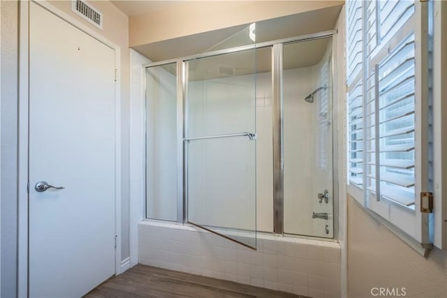 bathroom with hardwood / wood-style flooring