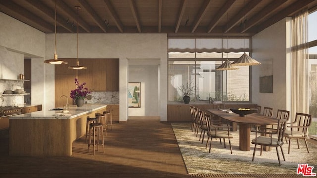 dining area featuring beam ceiling, dark hardwood / wood-style floors, a high ceiling, and sink