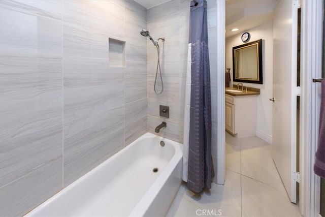 bathroom featuring shower / tub combo with curtain, vanity, and tile patterned flooring