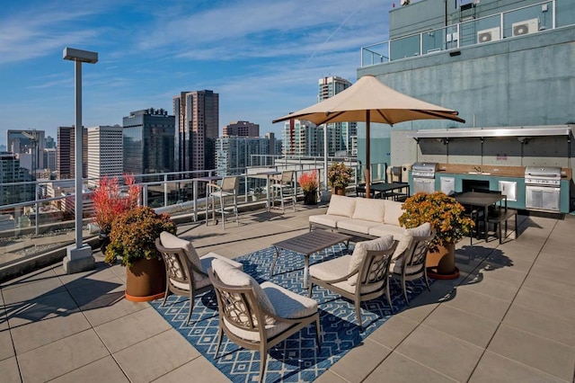 view of patio with a balcony and sink