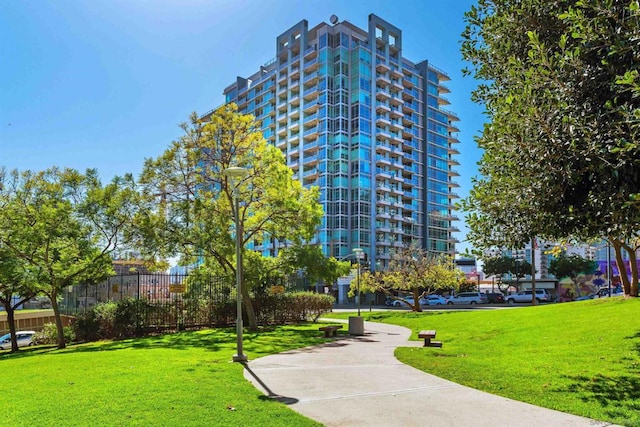 view of home's community with a lawn