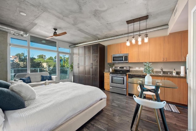 bedroom featuring ceiling fan, dark wood-type flooring, and sink