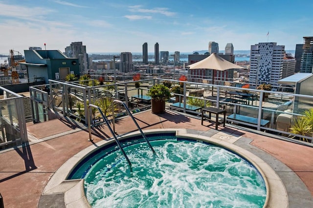 view of swimming pool featuring a community hot tub