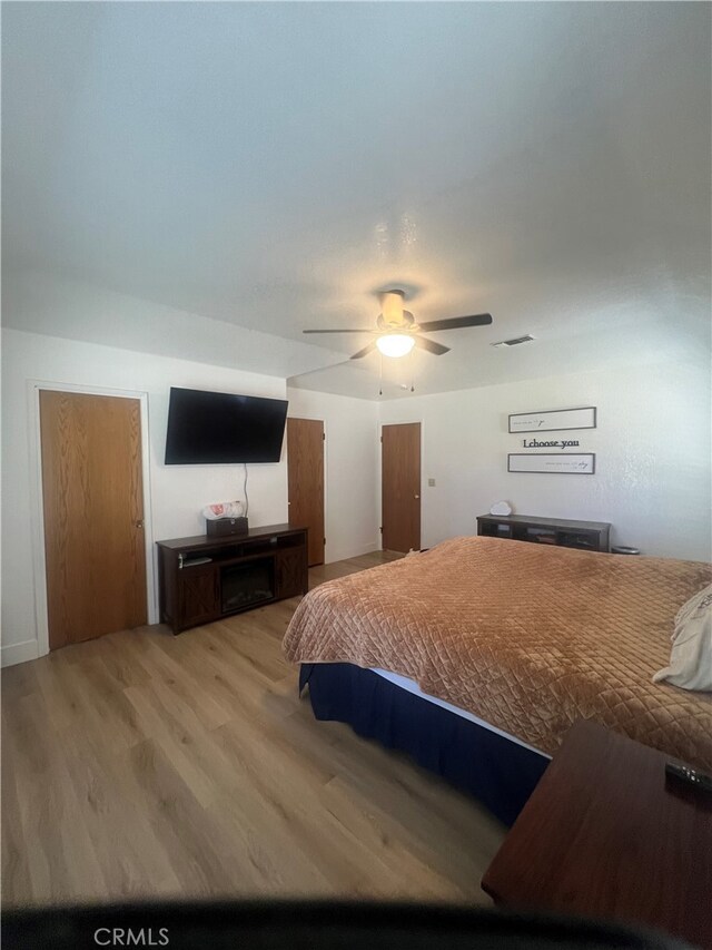 bedroom featuring ceiling fan and hardwood / wood-style floors