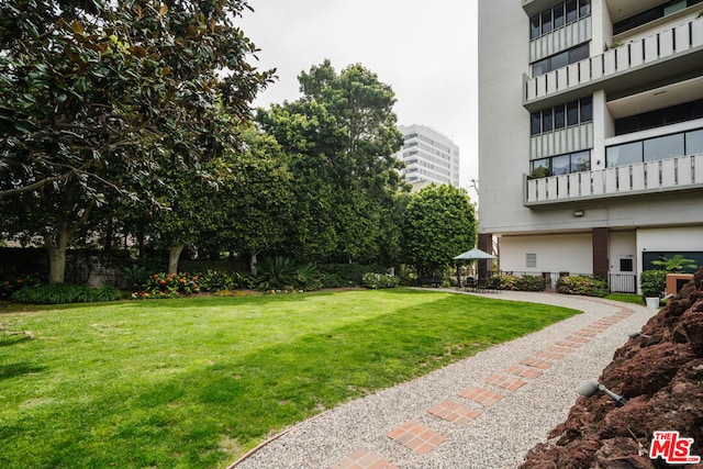 view of yard with a gazebo and a balcony