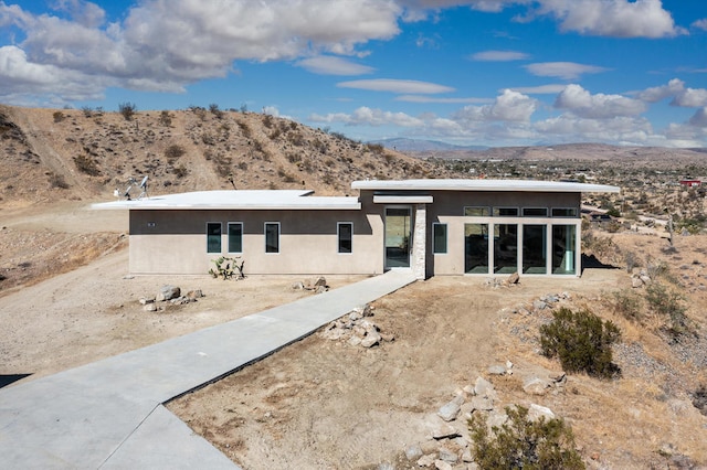 view of front of property with a mountain view