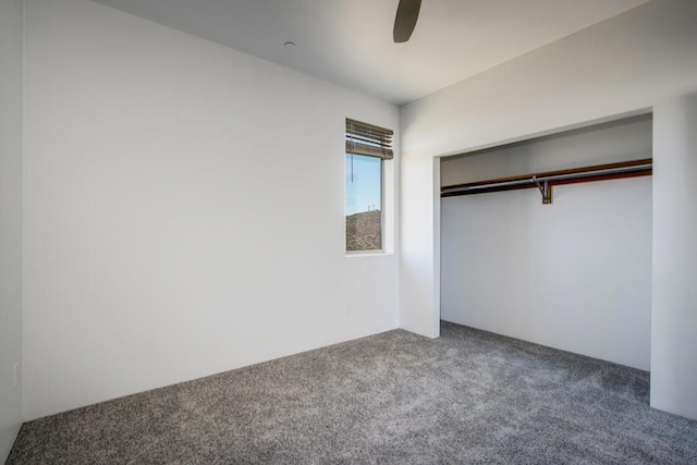 unfurnished bedroom with ceiling fan, a closet, and carpet