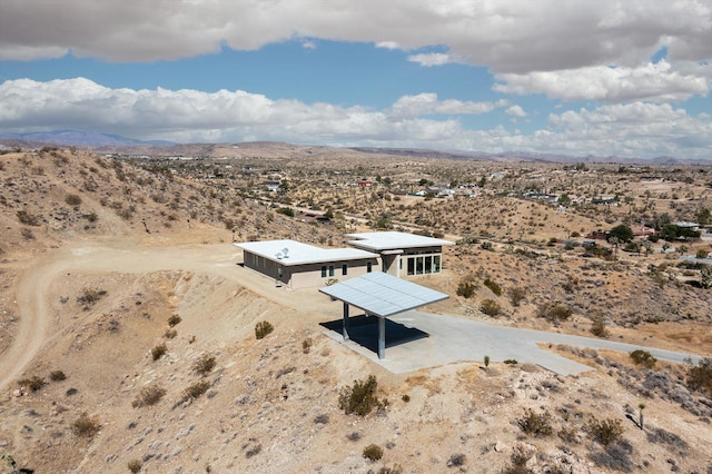 birds eye view of property with a mountain view