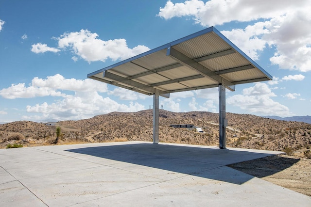 exterior space featuring a mountain view and a carport