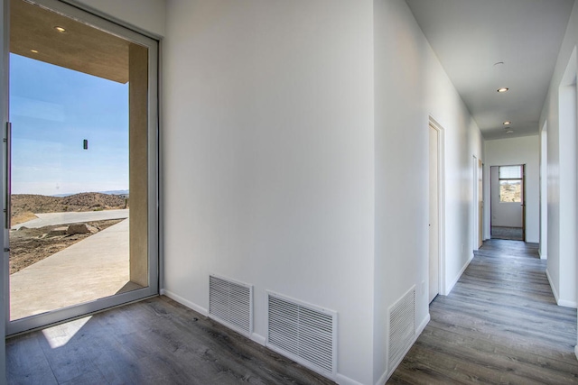 hall with dark wood-type flooring and a mountain view