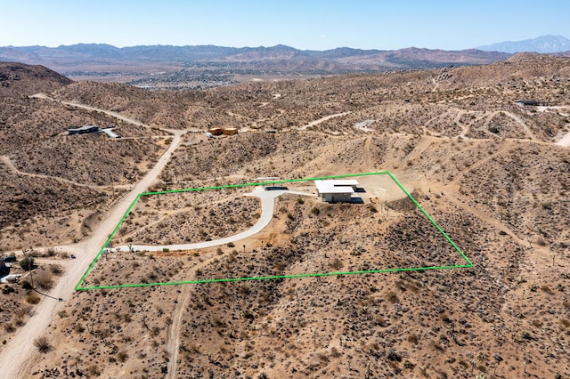 drone / aerial view featuring a mountain view