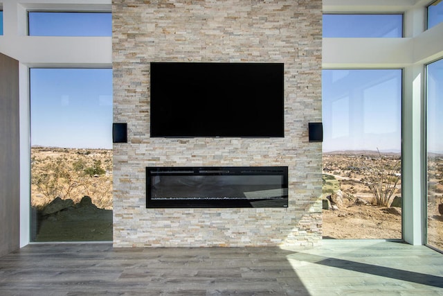 interior details with a fireplace and hardwood / wood-style floors