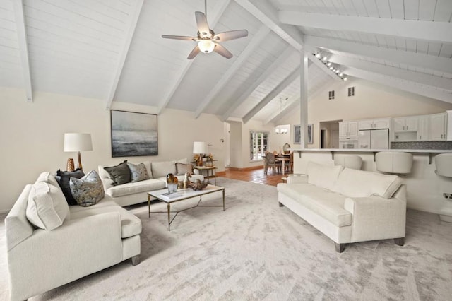 living room featuring beam ceiling, ceiling fan, high vaulted ceiling, and light wood-type flooring