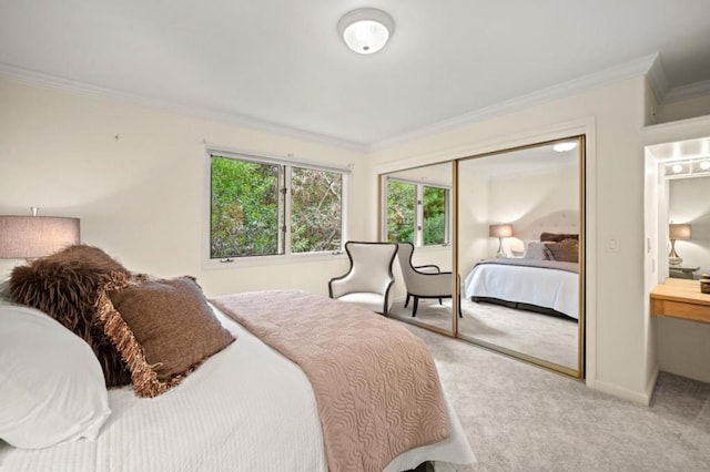 bedroom featuring crown molding, light carpet, and a closet