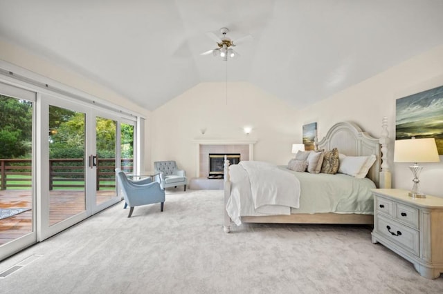 bedroom featuring access to outside, light colored carpet, ceiling fan, a tile fireplace, and lofted ceiling