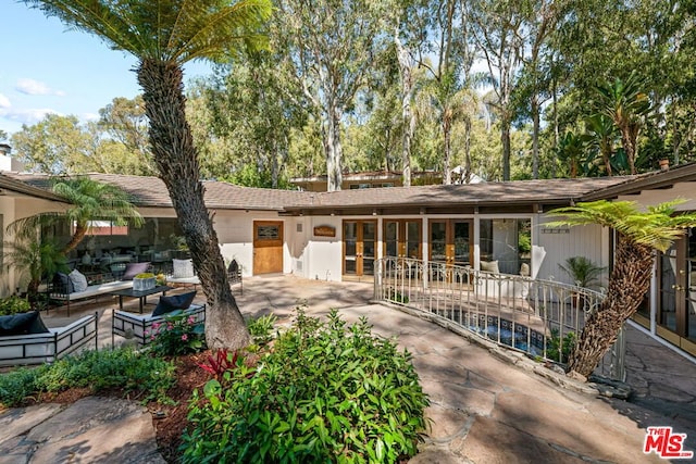 back of house with a patio