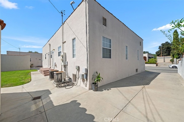 back of house with a patio area