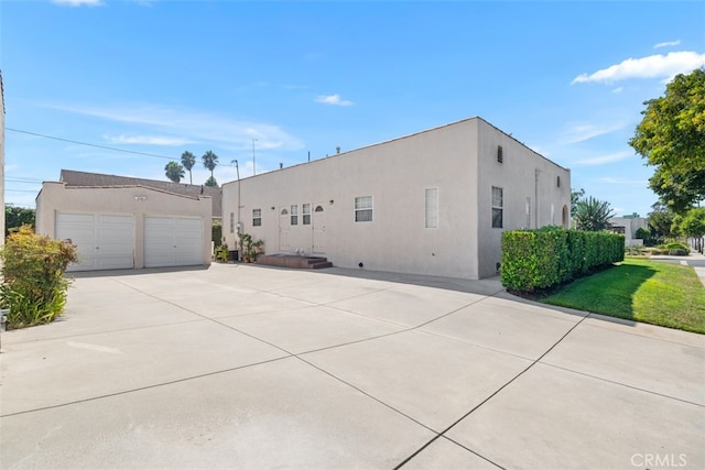 view of property exterior with a garage