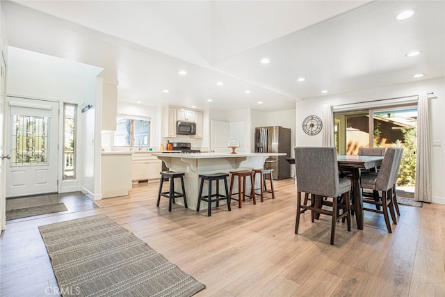 dining area featuring light wood-type flooring