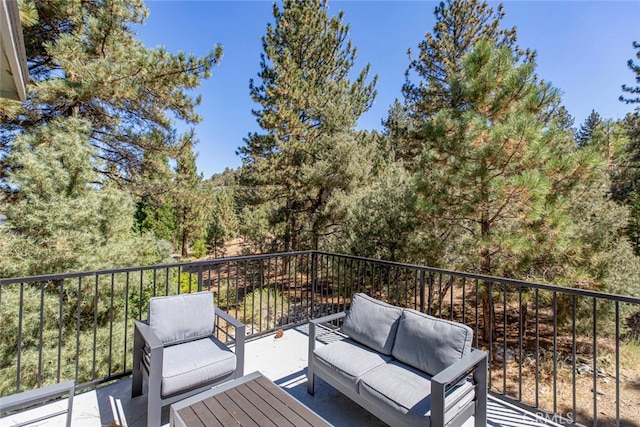 wooden deck featuring outdoor lounge area