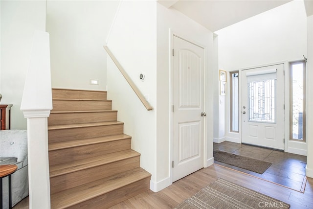 foyer entrance with hardwood / wood-style flooring