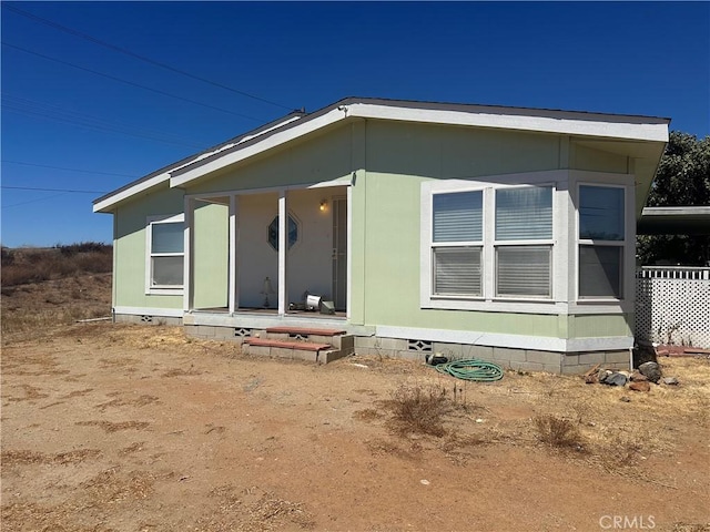 exterior space with crawl space