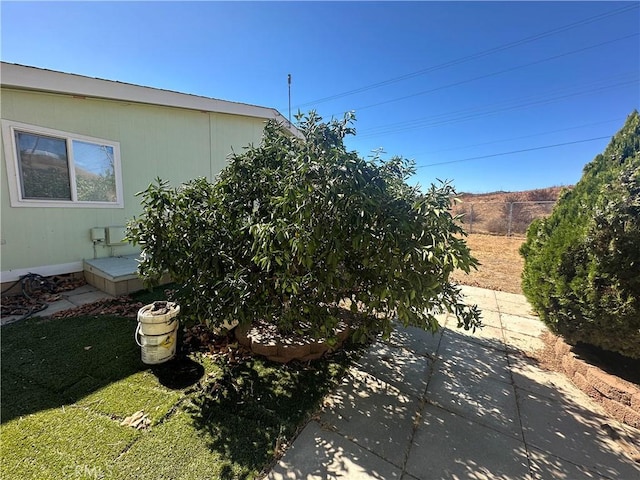 view of yard featuring a patio area and fence