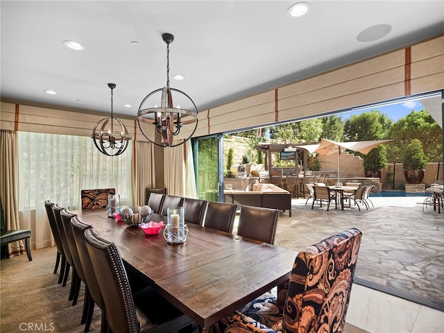 dining area featuring a notable chandelier