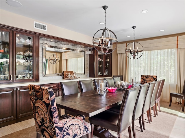 dining space featuring a notable chandelier