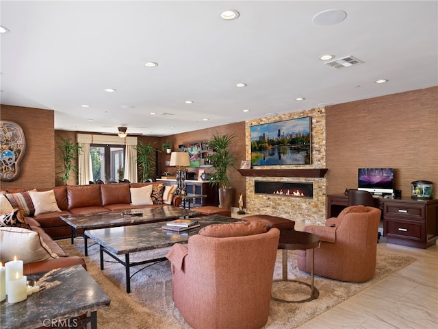 living room with a stone fireplace