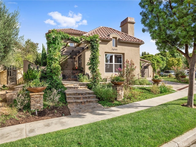 mediterranean / spanish-style house with a front yard