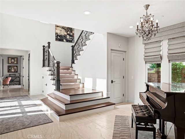 entrance foyer featuring a notable chandelier