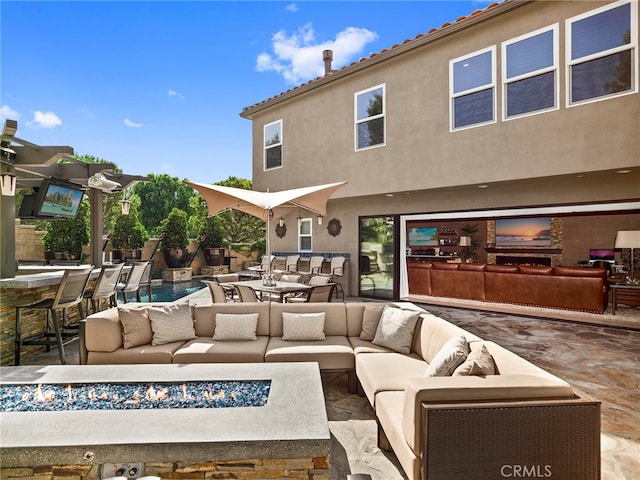 view of patio / terrace featuring an outdoor hangout area and a bar