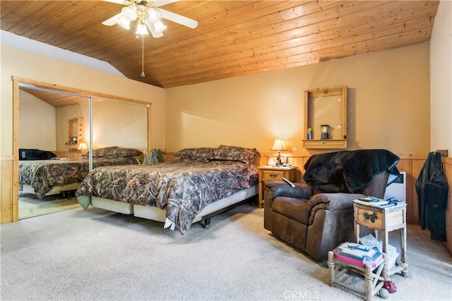 carpeted bedroom with wood ceiling, a closet, lofted ceiling, and ceiling fan