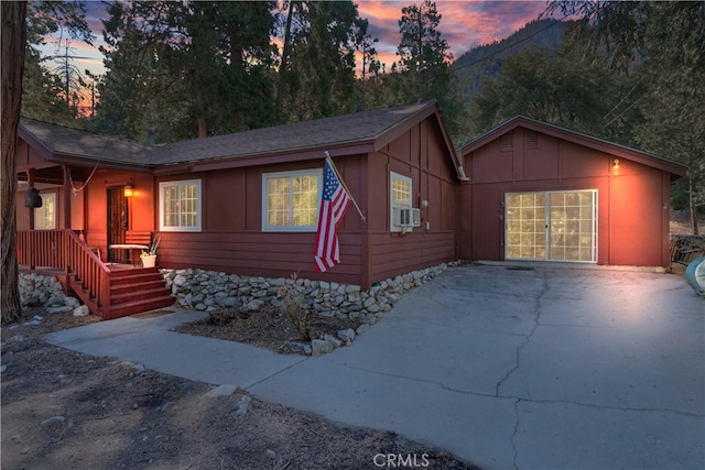 ranch-style home featuring cooling unit