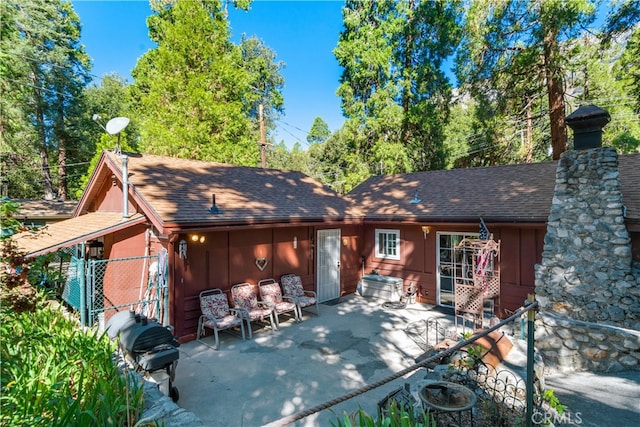 back of property with a patio area