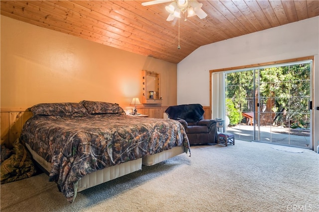 carpeted bedroom with ceiling fan, lofted ceiling, wooden walls, wooden ceiling, and access to exterior