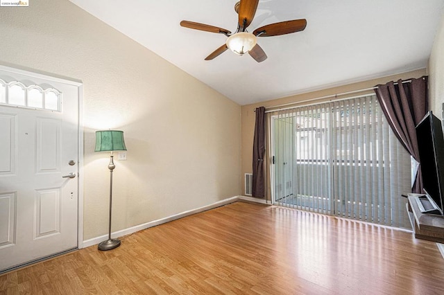 entrance foyer featuring vaulted ceiling, ceiling fan, and hardwood / wood-style floors