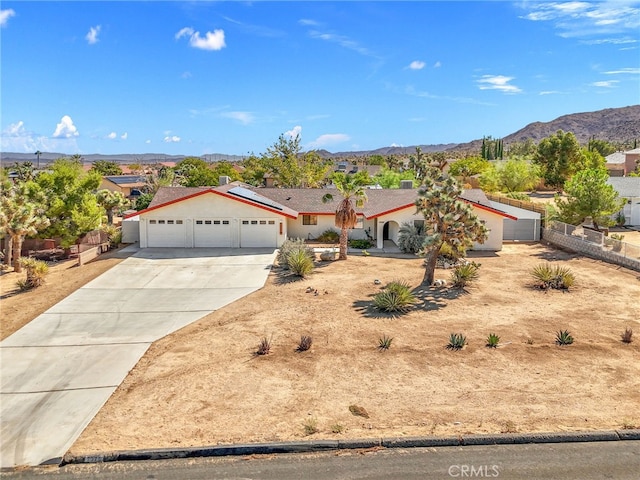 single story home with a mountain view