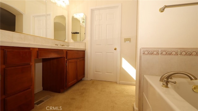 bathroom with a bathtub and vanity