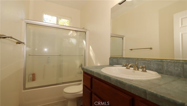 full bathroom with tasteful backsplash, vanity, tile patterned flooring, bath / shower combo with glass door, and toilet